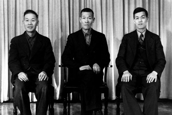 3 chinese males sitting on chairs, WONG Fang, WONG Fee and one unknown male